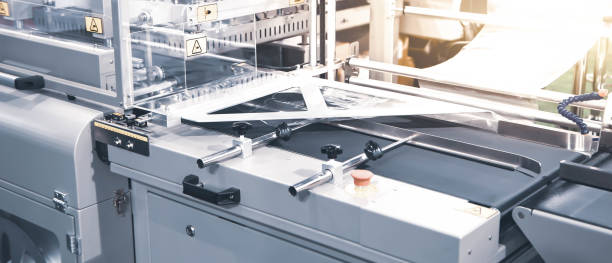 Package shrink film wraping machine in modern warehouse.